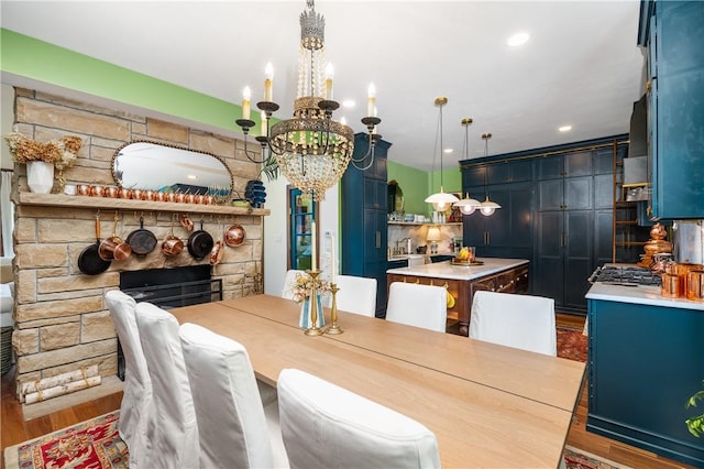 311 Derry Ridge Rd, Ligonier Twp, PA 15658 - dining room with a chandelier, wood finished floors, and a fireplace