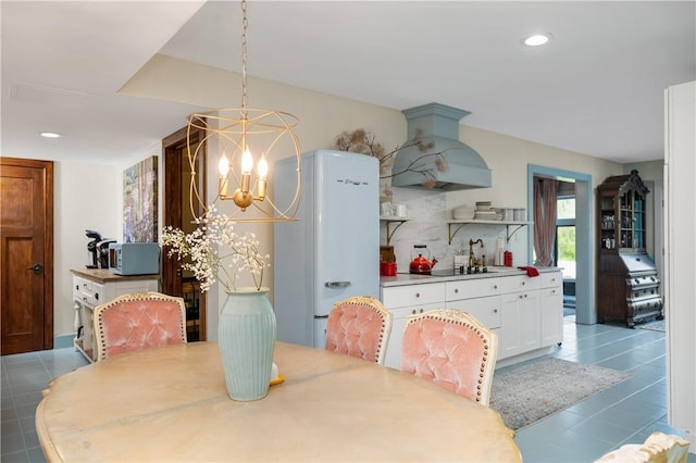 311 Derry Ridge Rd, Ligonier Twp, PA 15658 - dining space featuring a chandelier, tile patterned flooring, and recessed lighting