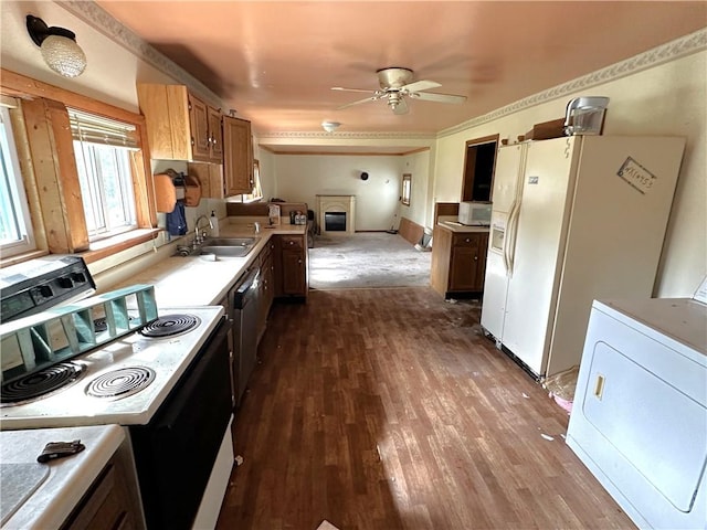 305 3rd St, Unity Twp, PA 15638 - kitchen featuring white appliances, a sink, a ceiling fan, light countertops, and dark wood-style flooring