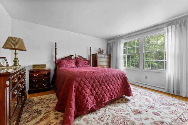 1467 Meteor Cir, Upper St Clair, PA 15241 - bedroom with wood finished floors and a baseboard heating unit