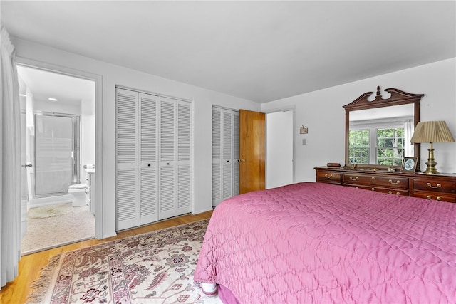 1467 Meteor Cir, Upper St Clair, PA 15241 - bedroom featuring light wood-type flooring, two closets, and connected bathroom