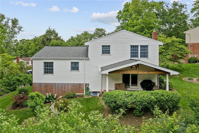 1467 Meteor Cir, Upper St Clair, PA 15241 - back of property with a chimney, a lawn, and roof with shingles