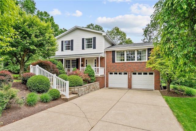 1467 Meteor Cir, Upper St Clair, PA 15241 - split level home with driveway, a porch, an attached garage, and brick siding