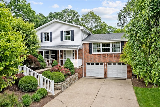 1467 Meteor Cir, Upper St Clair, PA 15241 - split level home featuring covered porch, concrete driveway, a garage, brick siding, and roof with shingles