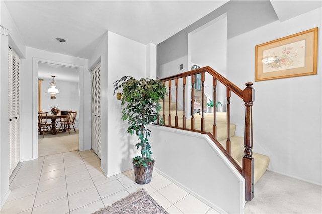 1467 Meteor Cir, Upper St Clair, PA 15241 - staircase with carpet floors, tile patterned floors, and baseboards