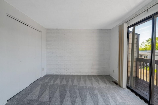 3143 Camberly Dr, Hampton, PA 15044 - unfurnished bedroom with brick wall, carpet flooring, and access to outside