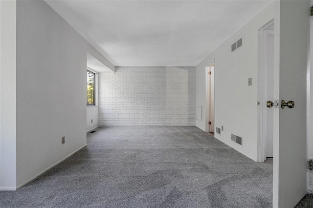 3143 Camberly Dr, Hampton, PA 15044 - spare room with brick wall, carpet flooring, and baseboards