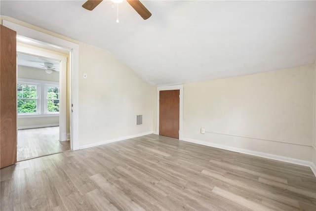 1030 N Grandview Ave, Mckeesport, PA 15132 - empty room featuring ceiling fan, wood finished floors, vaulted ceiling, and baseboards