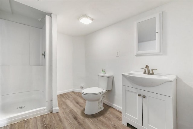 1030 N Grandview Ave, Mckeesport, PA 15132 - full bathroom with vanity, a stall shower, toilet, wood finished floors, and baseboards