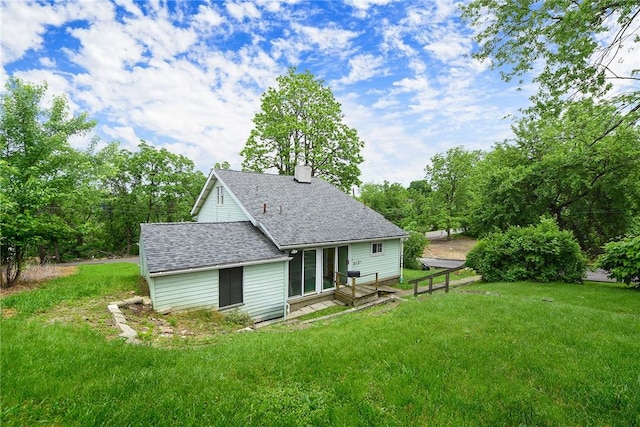 1030 N Grandview Ave, Mckeesport, PA 15132 - back of property with a yard, a chimney, roof with shingles, and a wooden deck