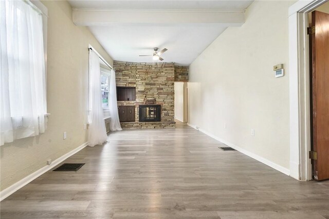 1030 N Grandview Ave, Mckeesport, PA 15132 - unfurnished living room featuring a ceiling fan, wood finished floors, a fireplace, and baseboards