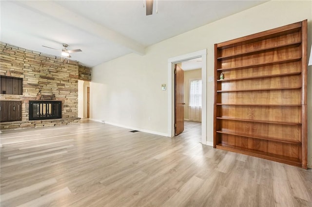 1030 N Grandview Ave, Mckeesport, PA 15132 - unfurnished living room featuring ceiling fan, wood finished floors, a fireplace, and baseboards