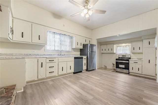 1030 N Grandview Ave, Mckeesport, PA 15132 - kitchen with appliances with stainless steel finishes, ceiling fan, light wood finished floors, light countertops, and a sink