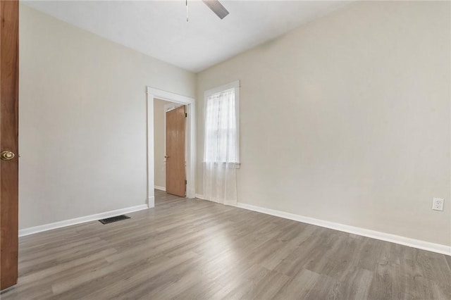 1030 N Grandview Ave, Mckeesport, PA 15132 - empty room with wood finished floors, ceiling fan, and baseboards