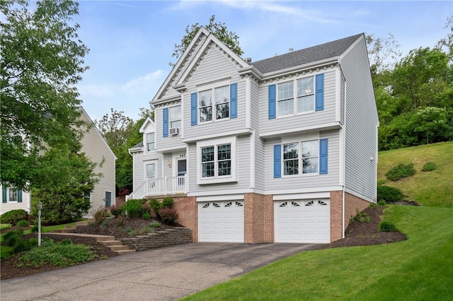 407 Pine Trees Dr, Scott Twp Sal, PA 15106 - view of front of home with asphalt driveway, an attached garage, brick siding, and a front lawn