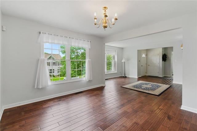 407 Pine Trees Dr, Scott Twp Sal, PA 15106 - foyer entrance with a chandelier, wood finished floors, and baseboards