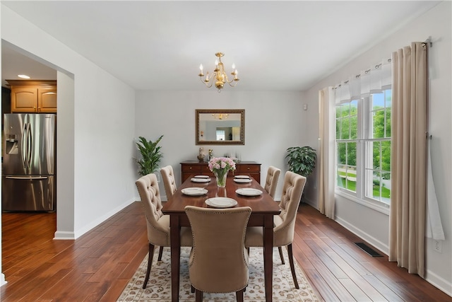 407 Pine Trees Dr, Scott Twp Sal, PA 15106 - dining space featuring a chandelier, baseboards, and hardwood / wood-style flooring