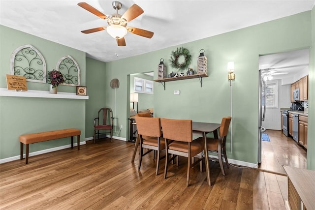 1241 Arkansas Ave, Dormont, PA 15216 - dining area with ceiling fan, wood finished floors, and baseboards