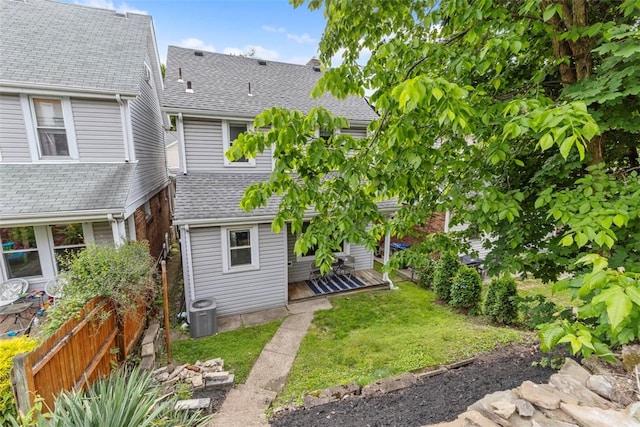 1241 Arkansas Ave, Dormont, PA 15216 - rear view of house with roof with shingles, a wooden deck, and a lawn
