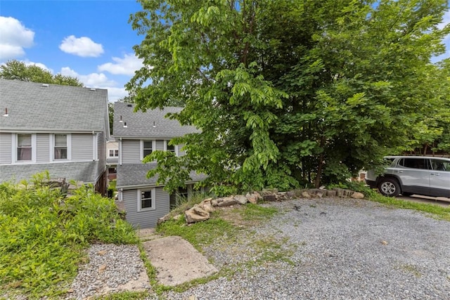 1241 Arkansas Ave, Dormont, PA 15216 - view of side of property with a shingled roof and an outdoor structure