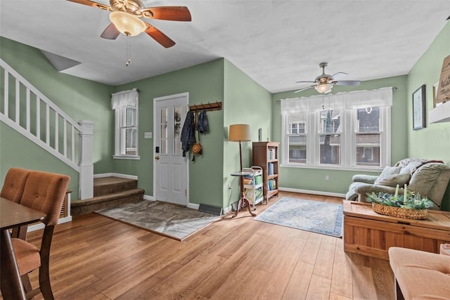 1241 Arkansas Ave, Dormont, PA 15216 - foyer with a ceiling fan, wood finished floors, stairway, and baseboards