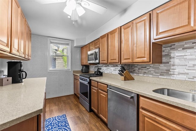 1241 Arkansas Ave, Dormont, PA 15216 - kitchen with stainless steel appliances, ceiling fan, light countertops, tasteful backsplash, and tile walls