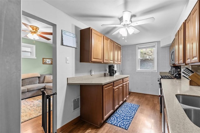 1241 Arkansas Ave, Dormont, PA 15216 - kitchen with ceiling fan, wood finished floors, and light countertops