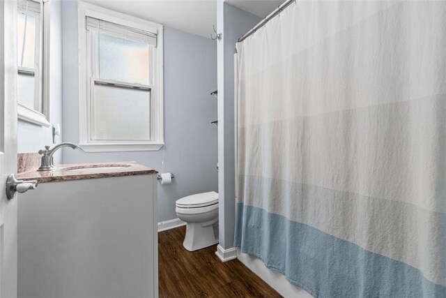 1241 Arkansas Ave, Dormont, PA 15216 - full bath featuring toilet, wood finished floors, vanity, baseboards, and a shower with curtain