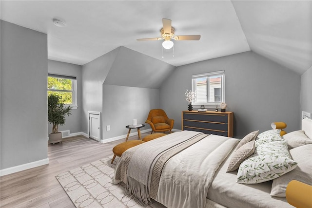 2140 Carolina Ave, West Mifflin, PA 15122 - bedroom featuring multiple windows, wood finished floors, lofted ceiling, baseboards, and ceiling fan