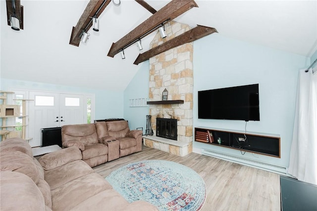 3 Coates Ln, White Twp Ind, PA 15701 - living area featuring wood finished floors, a fireplace, and track lighting