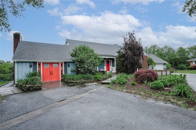 3 Coates Ln, White Twp Ind, PA 15701 - obstructed view of property featuring a chimney and a shingled roof