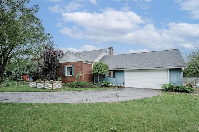 3 Coates Ln, White Twp Ind, PA 15701 - view of front of property featuring a front yard, asphalt driveway, an attached garage, and a chimney