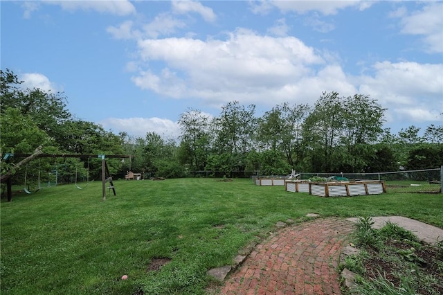 3 Coates Ln, White Twp Ind, PA 15701 - view of yard featuring a vegetable garden, a playground, and view of wooded area