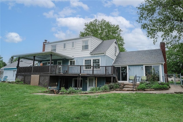 3 Coates Ln, White Twp Ind, PA 15701 - back of property featuring a chimney, a wooden deck, a yard, and a shingled roof