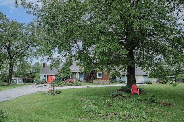 3 Coates Ln, White Twp Ind, PA 15701 - view of property hidden behind natural elements featuring driveway, a front yard, and a chimney