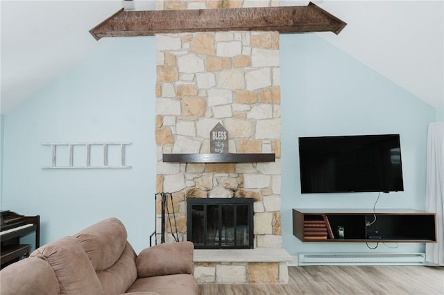 3 Coates Ln, White Twp Ind, PA 15701 - living room with lofted ceiling, wood finished floors, baseboard heating, and a stone fireplace