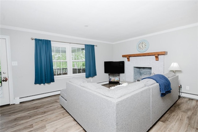 3 Coates Ln, White Twp Ind, PA 15701 - living room with a baseboard heating unit, ornamental molding, wood finished floors, and a brick fireplace