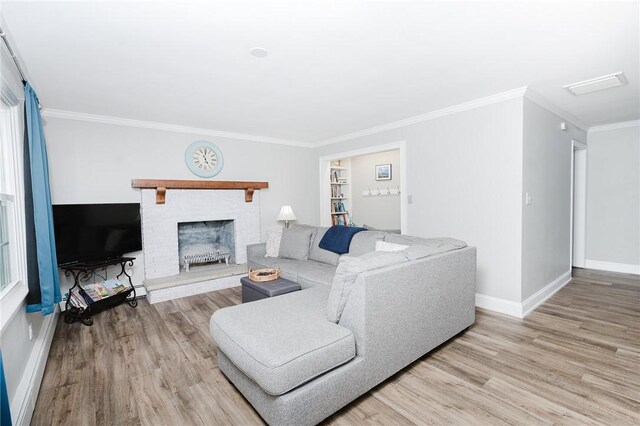 3 Coates Ln, White Twp Ind, PA 15701 - living room with wood finished floors, baseboards, ornamental molding, and a fireplace