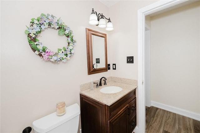 3 Coates Ln, White Twp Ind, PA 15701 - half bath featuring vanity, wood finished floors, toilet, and baseboards