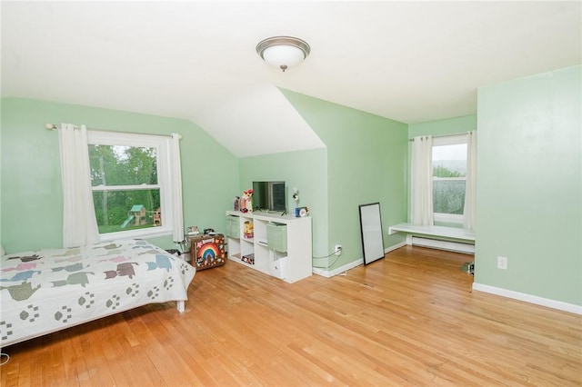 3 Coates Ln, White Twp Ind, PA 15701 - bedroom featuring a baseboard heating unit, light wood-type flooring, multiple windows, vaulted ceiling, and baseboards
