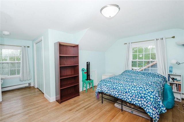 3 Coates Ln, White Twp Ind, PA 15701 - bedroom featuring a baseboard heating unit, light wood finished floors, multiple windows, lofted ceiling, and baseboards