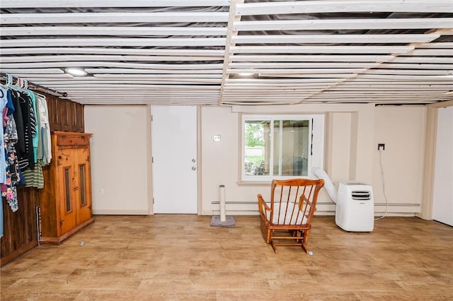 3 Coates Ln, White Twp Ind, PA 15701 - living area with light wood finished floors and a baseboard heating unit