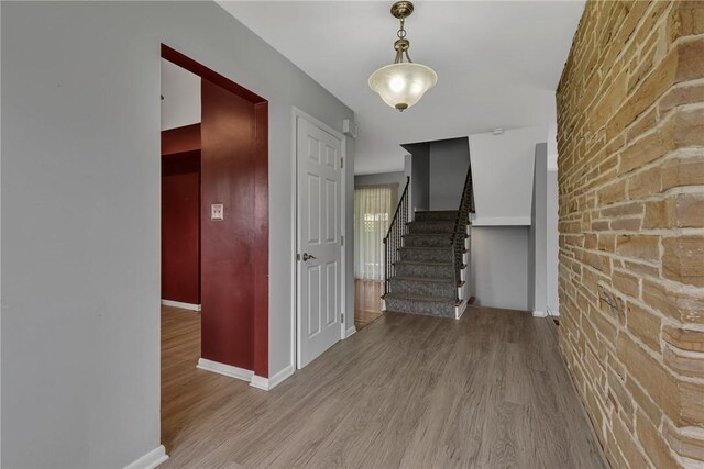 136 Upland Dr, Industry, PA 15052 - foyer entrance featuring wood finished floors, stairs, and baseboards