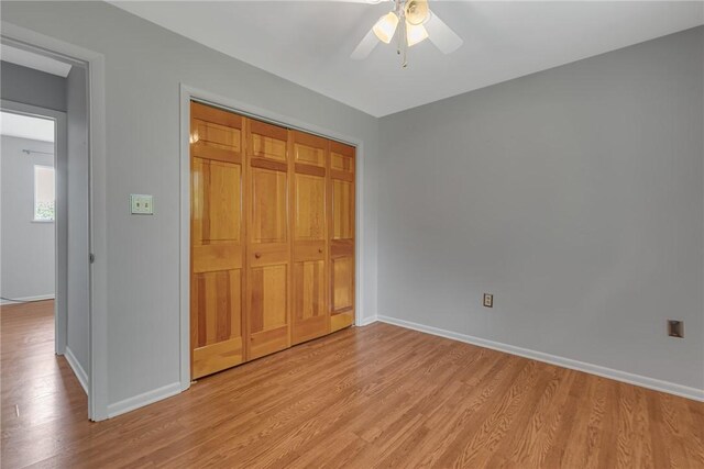 136 Upland Dr, Industry, PA 15052 - unfurnished bedroom featuring light wood-style flooring, baseboards, a closet, and ceiling fan