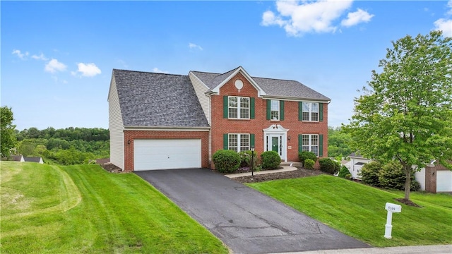 5109 Forest Ridge Dr, South Fayette, PA 15057 - colonial home with brick siding, a garage, asphalt driveway, and a front lawn
