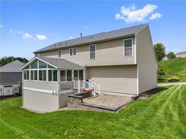 5109 Forest Ridge Dr, South Fayette, PA 15057 - back of property with a sunroom, a yard, central AC unit, and a shingled roof