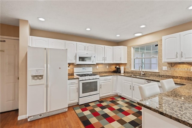 5109 Forest Ridge Dr, South Fayette, PA 15057 - kitchen with white appliances, a sink, white cabinets, light wood-type flooring, and recessed lighting