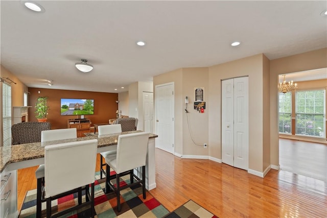 5109 Forest Ridge Dr, South Fayette, PA 15057 - dining area with a chandelier, light wood-type flooring, baseboards, and recessed lighting