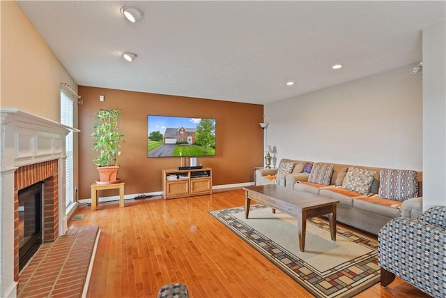 5109 Forest Ridge Dr, South Fayette, PA 15057 - living room featuring a fireplace, light wood finished floors, baseboards, and recessed lighting