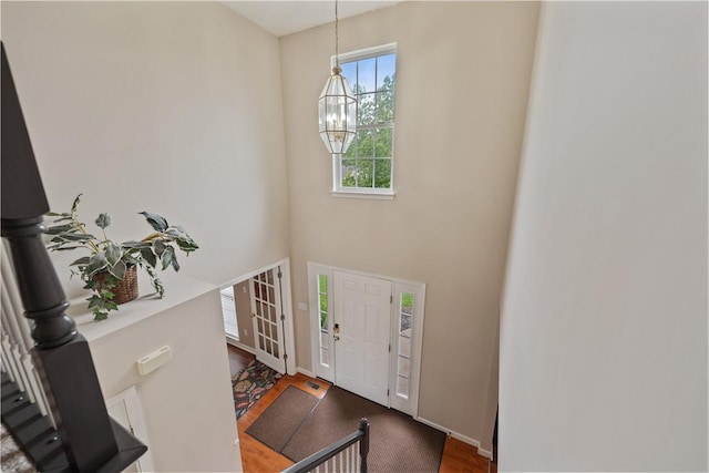 5109 Forest Ridge Dr, South Fayette, PA 15057 - foyer entrance with a chandelier, wood finished floors, and a high ceiling
